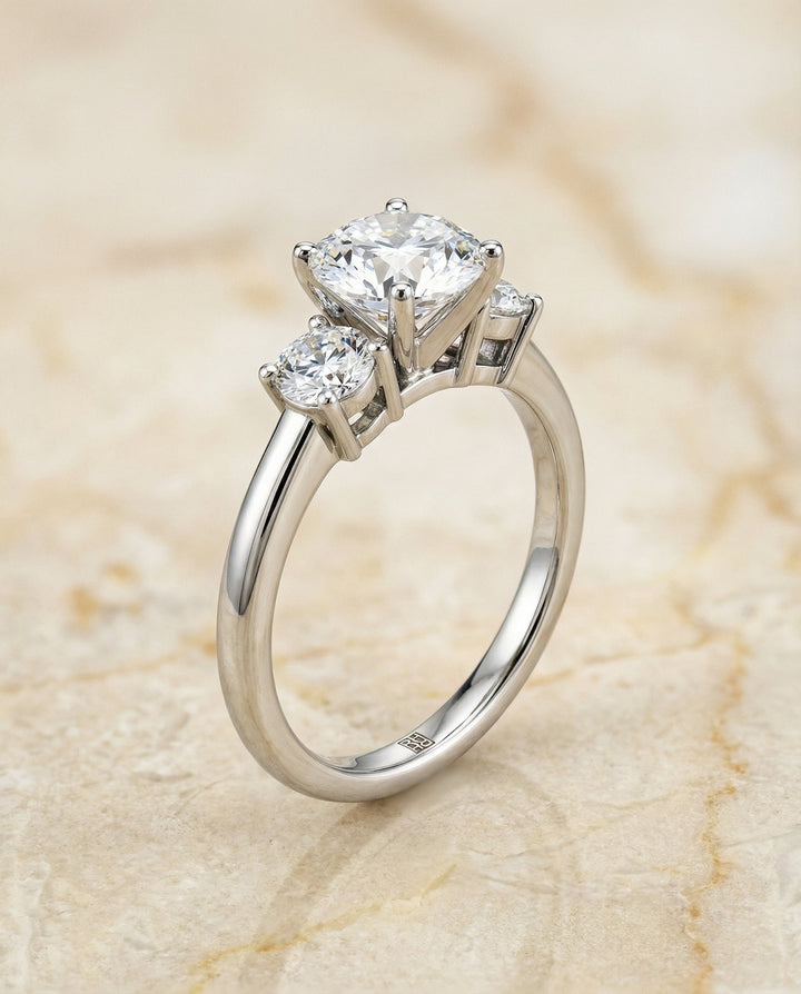 Round Brilliant, Classic Three Stone Round, in Platinum, prong setting – front view | RockHer