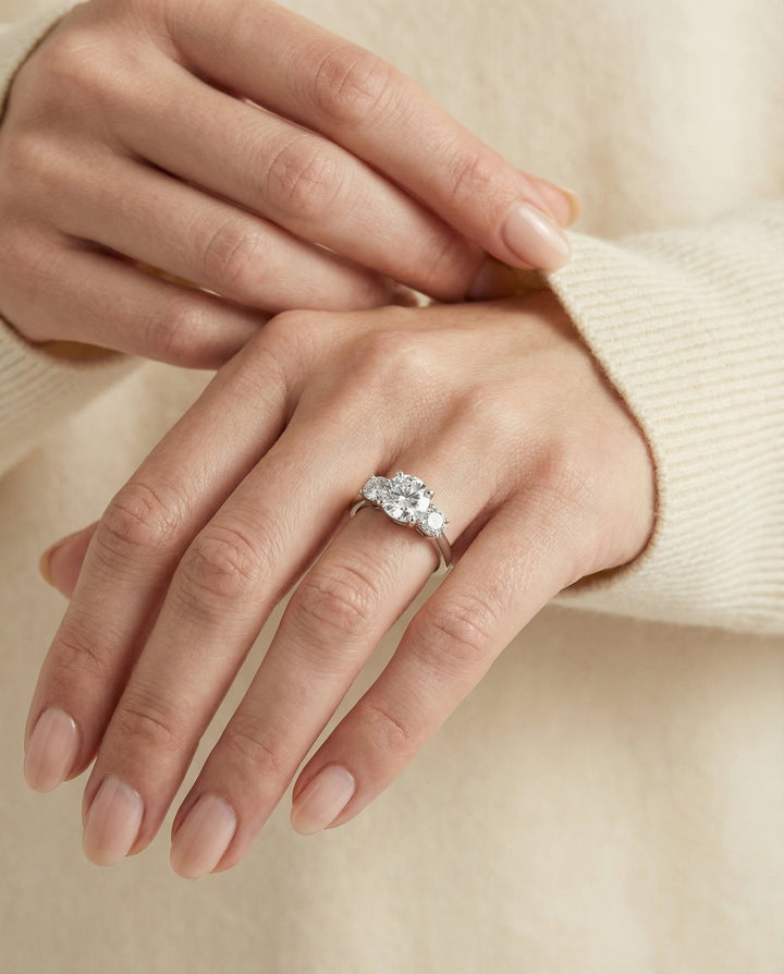 Round Brilliant, Classic Three Stone Round, in Platinum, prong setting – lifestyle shot | RockHer