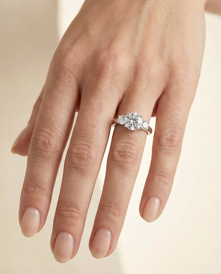 Round Brilliant, Classic Three Stone Round, in Platinum, prong setting – lifestyle shot | RockHer