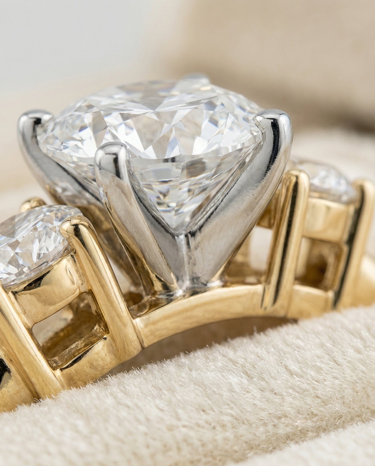 Round Brilliant, Classic Three Stone Round, in 18K Yellow Gold, prong setting – detail view | RockHer