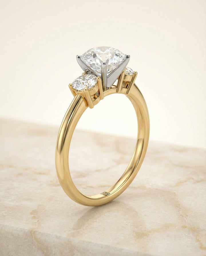 Round Brilliant, Classic Three Stone Round, in 18K Yellow Gold, prong setting – front view | RockHer