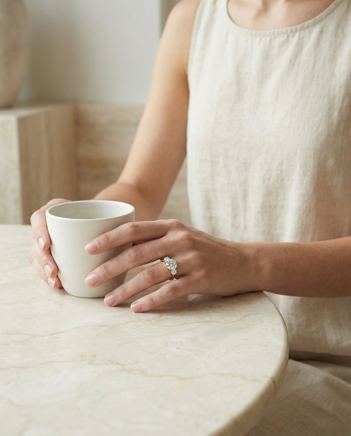 Round Brilliant, Classic Three Stone Round, in 18K Yellow Gold, prong setting – lifestyle shot | RockHer
