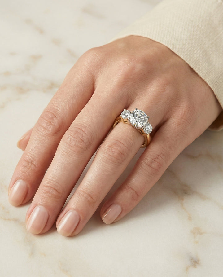 Round Brilliant, Classic Three Stone Round, in 18K Yellow Gold, prong setting – lifestyle shot | RockHer