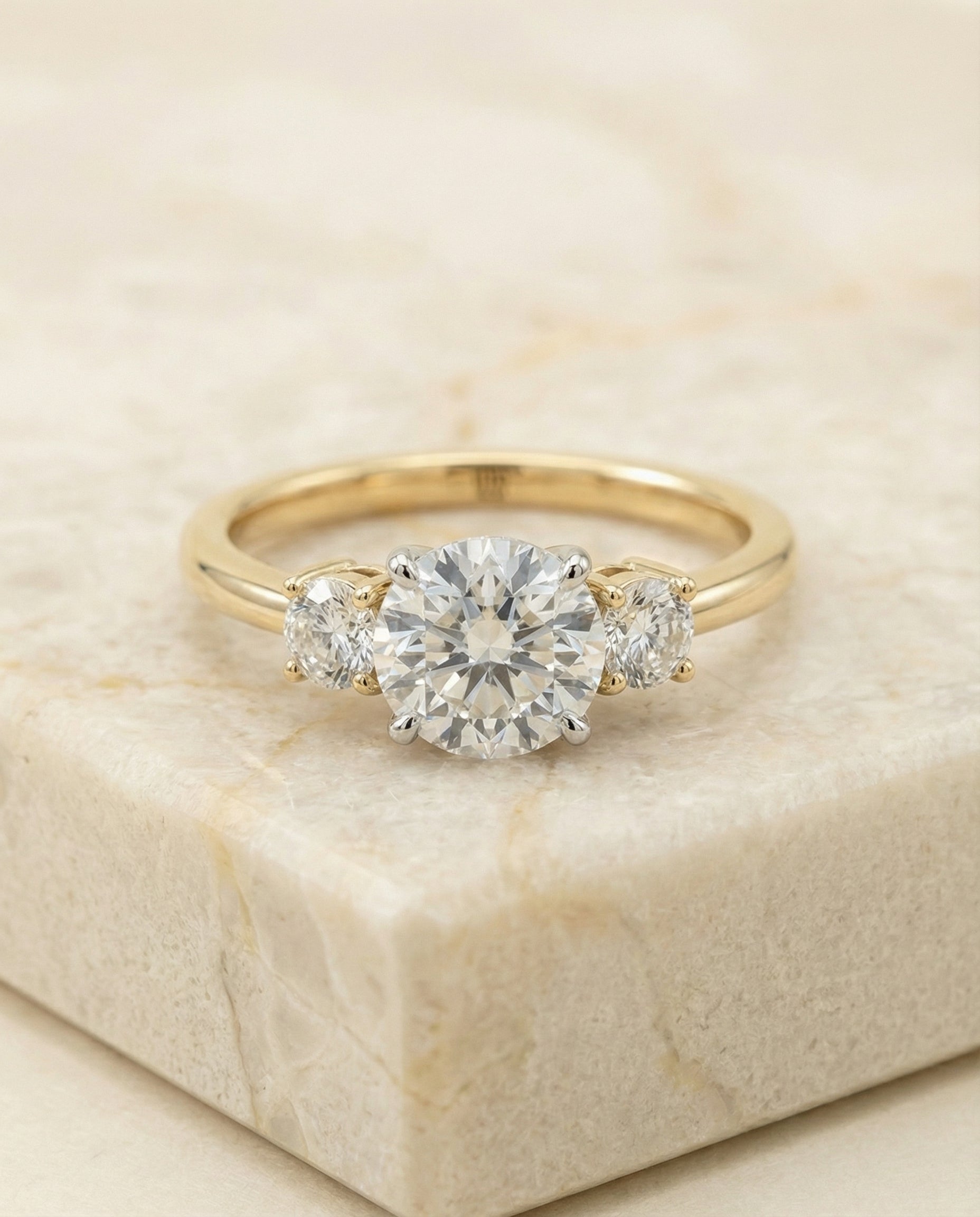 Round Brilliant, Classic Three Stone Round, in 18K Yellow Gold, prong setting – side profile | RockHer