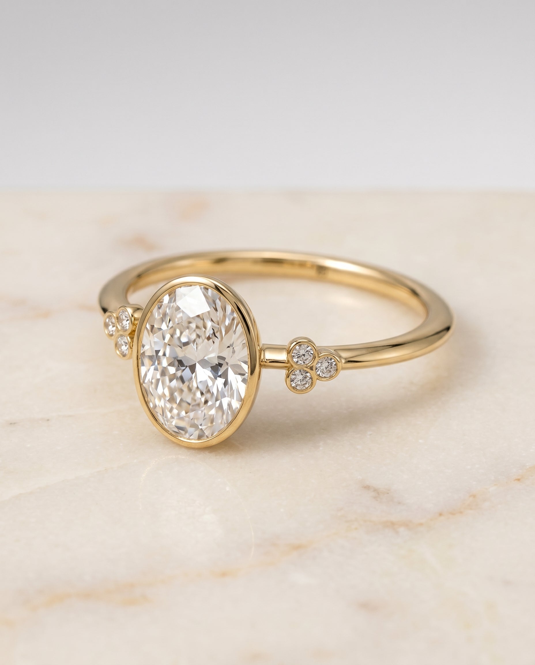 The Selena Bezel Solitaire Engagement Ring Setting for Oval Diamonds in 18K Yellow Gold | RockHer
