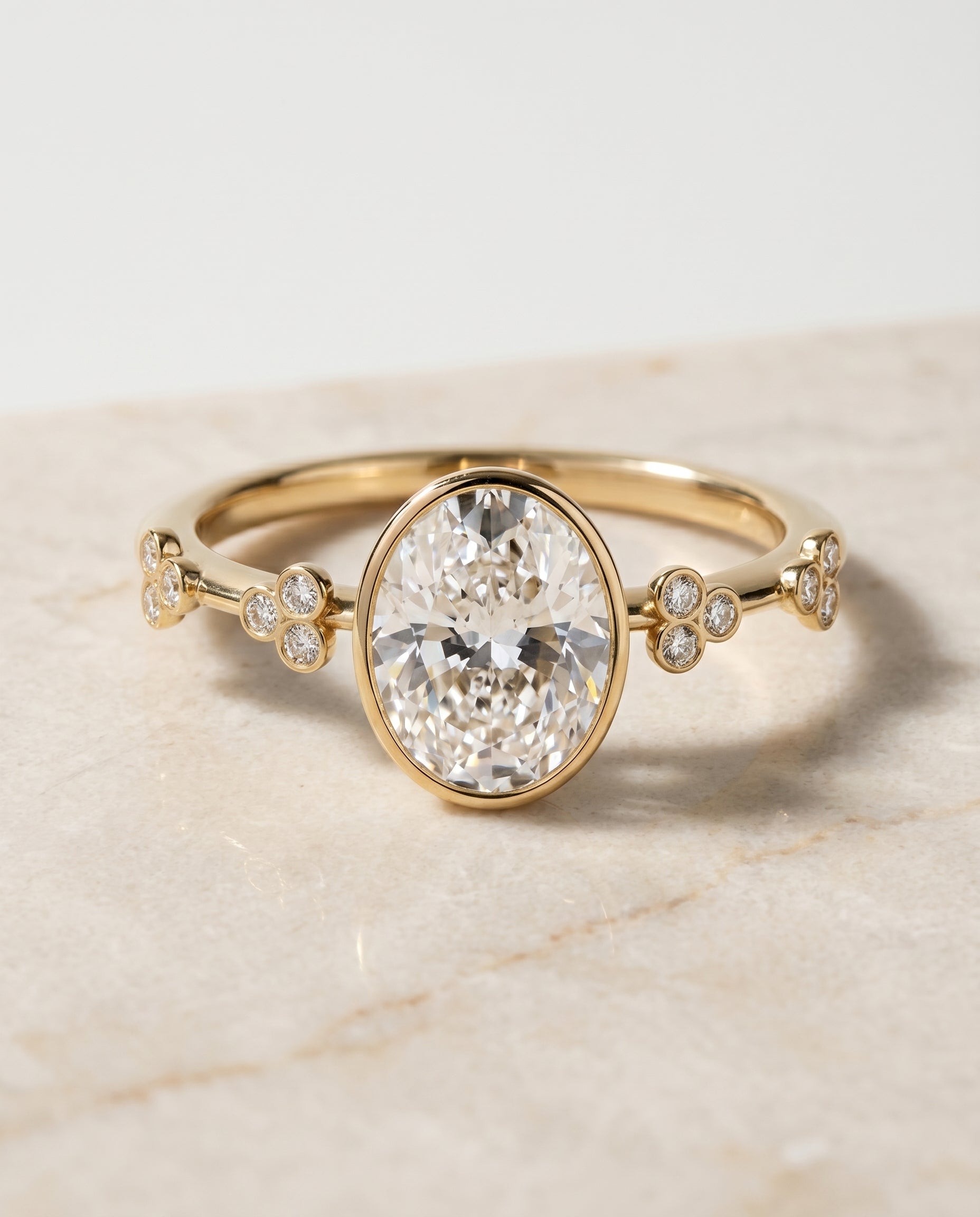 The Miley Bezel Solitaire Engagement Ring Setting for Oval Diamonds in 18K Yellow Gold | RockHer