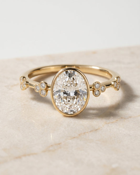 The Miley Bezel Solitaire Engagement Ring Setting for Oval Diamonds in 18K Yellow Gold | RockHer