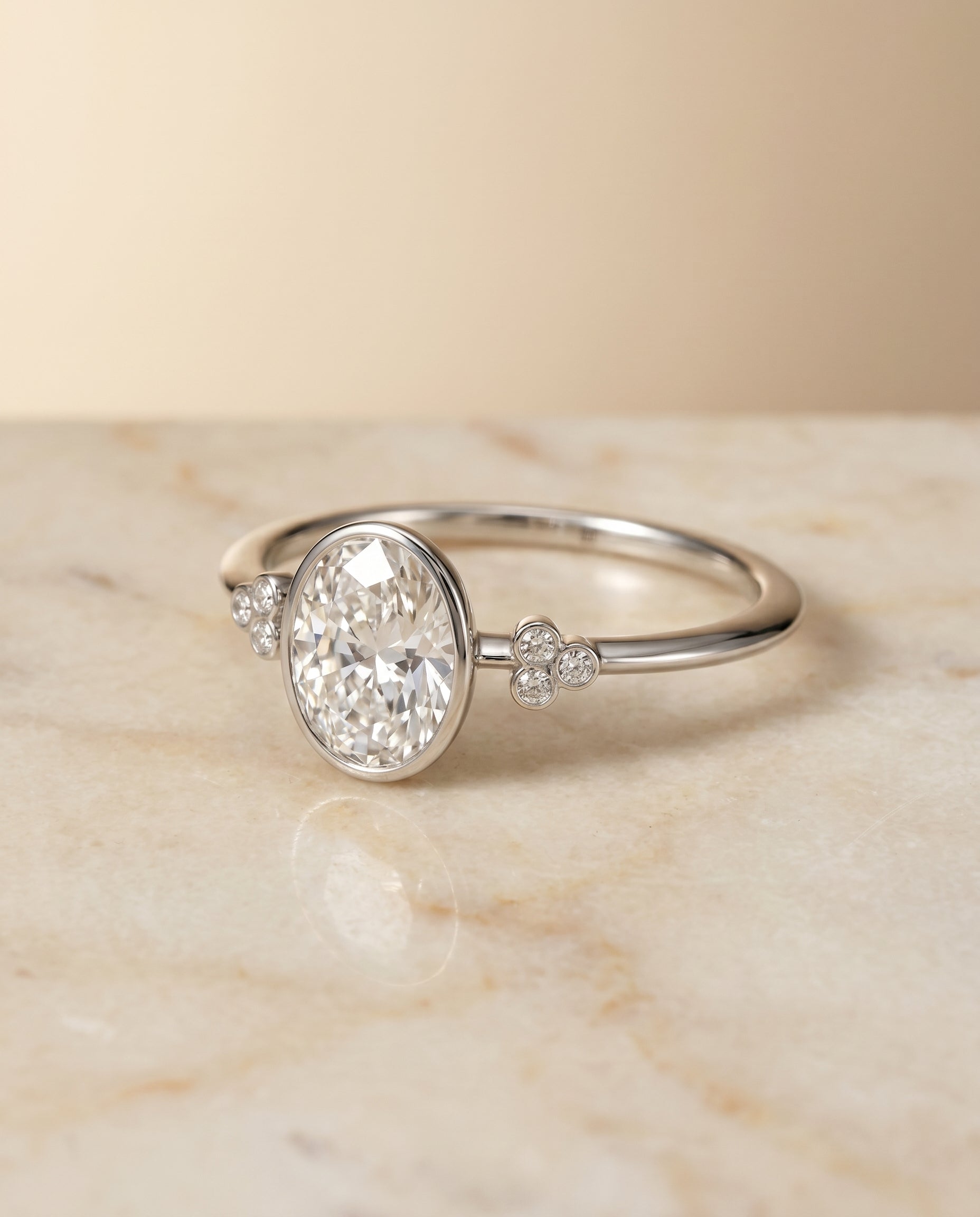 The Selena Bezel Solitaire Engagement Ring Setting for Oval Diamonds in 18K White Gold | RockHer