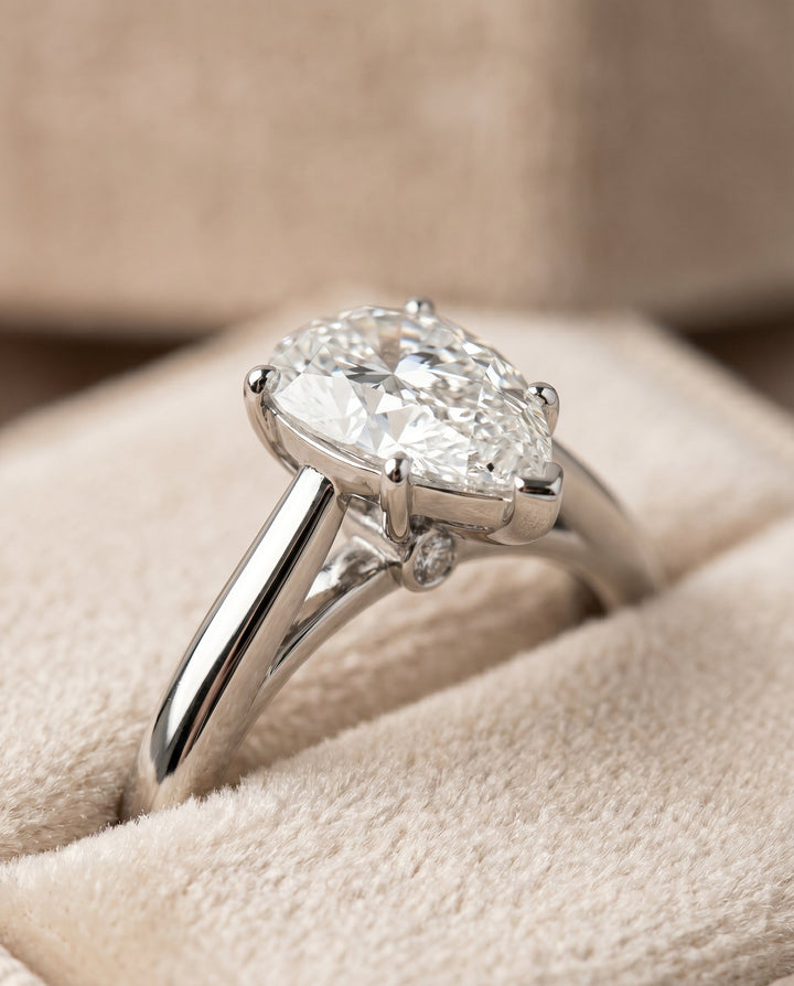 Comfort Fit Secret Stone Solitaire Pear Shape, in Platinum – detail view | RockHer
