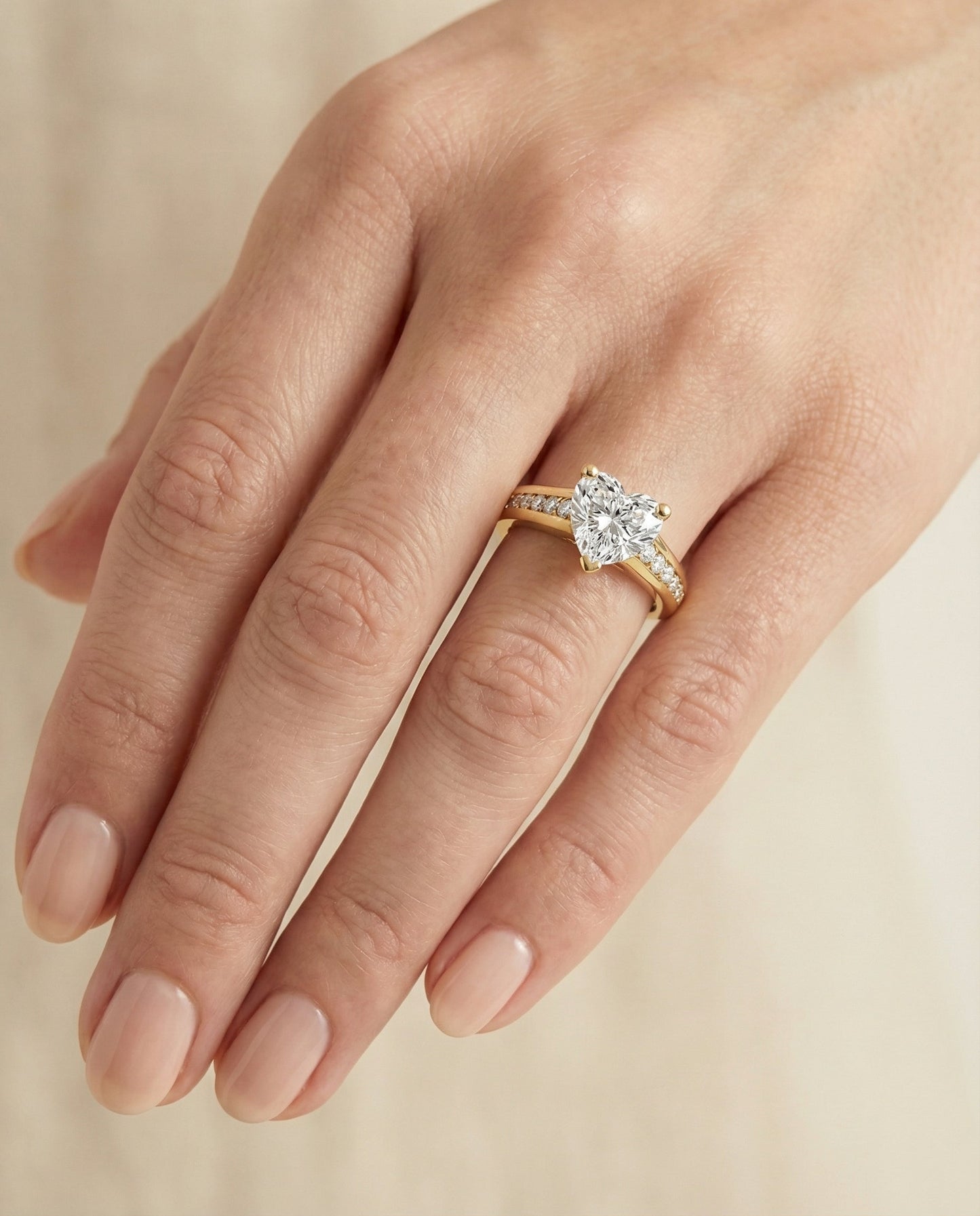 Contemporary Tapered Channel Heart Shape, in 18K Yellow Gold – lifestyle shot | RockHer