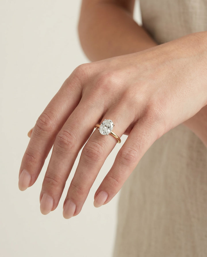 Cyndi Select Curved Hidden Halo Solitaire Oval in 14K Yellow Gold – view 3