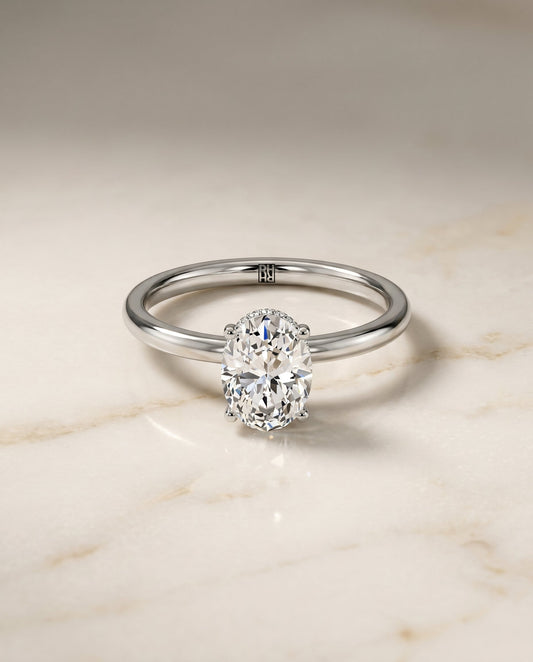 The Cyndi Hidden Halo Solitaire Engagement Ring Setting for Oval Diamonds in 18K White Gold | RockHer