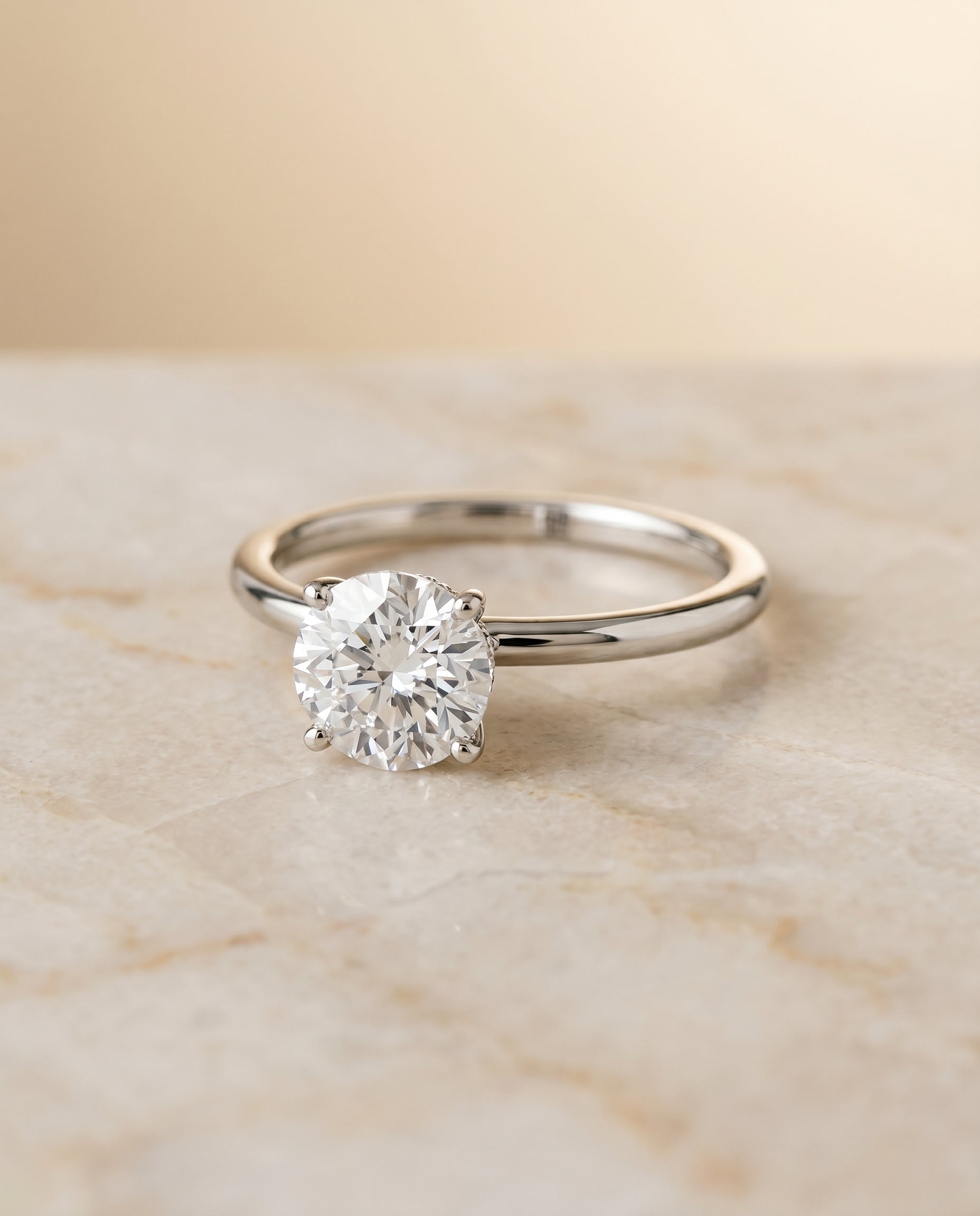 The Cyndi Hidden Halo Solitaire Engagement Ring Setting for Round Diamonds in 18K White Gold | RockHer