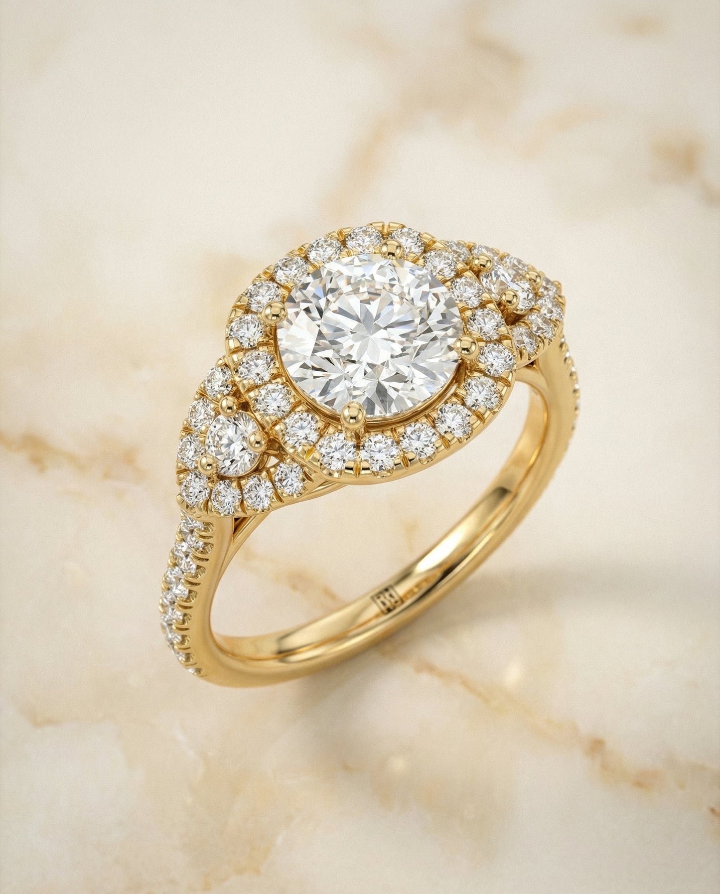Round Brilliant, Delicate Three Stone Halo, in 18K Yellow Gold, pave setting – angled view | RockHer