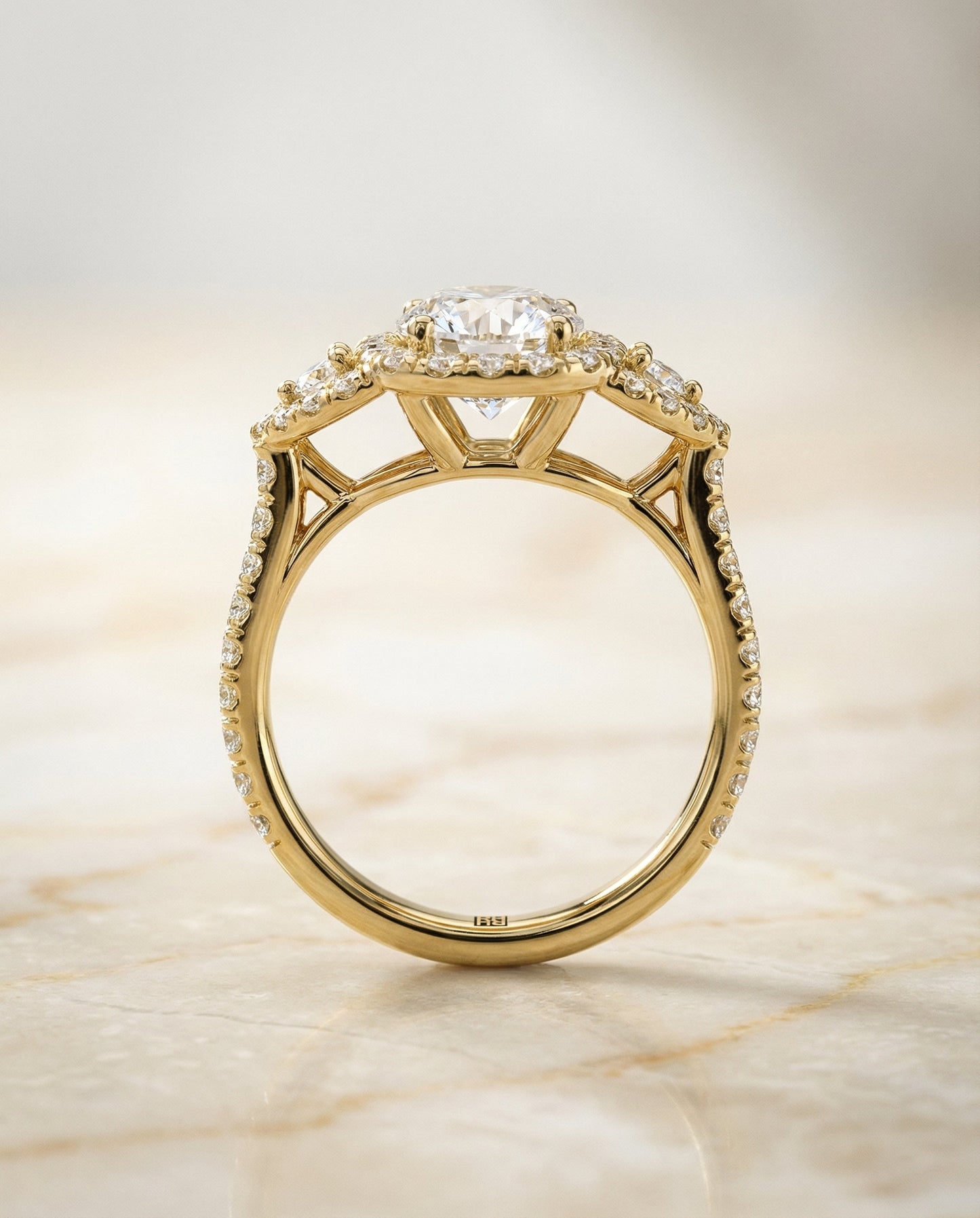 Round Brilliant, Delicate Three Stone Halo, in 18K Yellow Gold, pave setting – side profile | RockHer