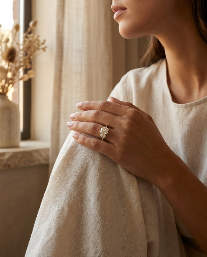 The Diana — Toi et Moi Cushion & Pear Pavé Band - Lifestyle scene with hand model
