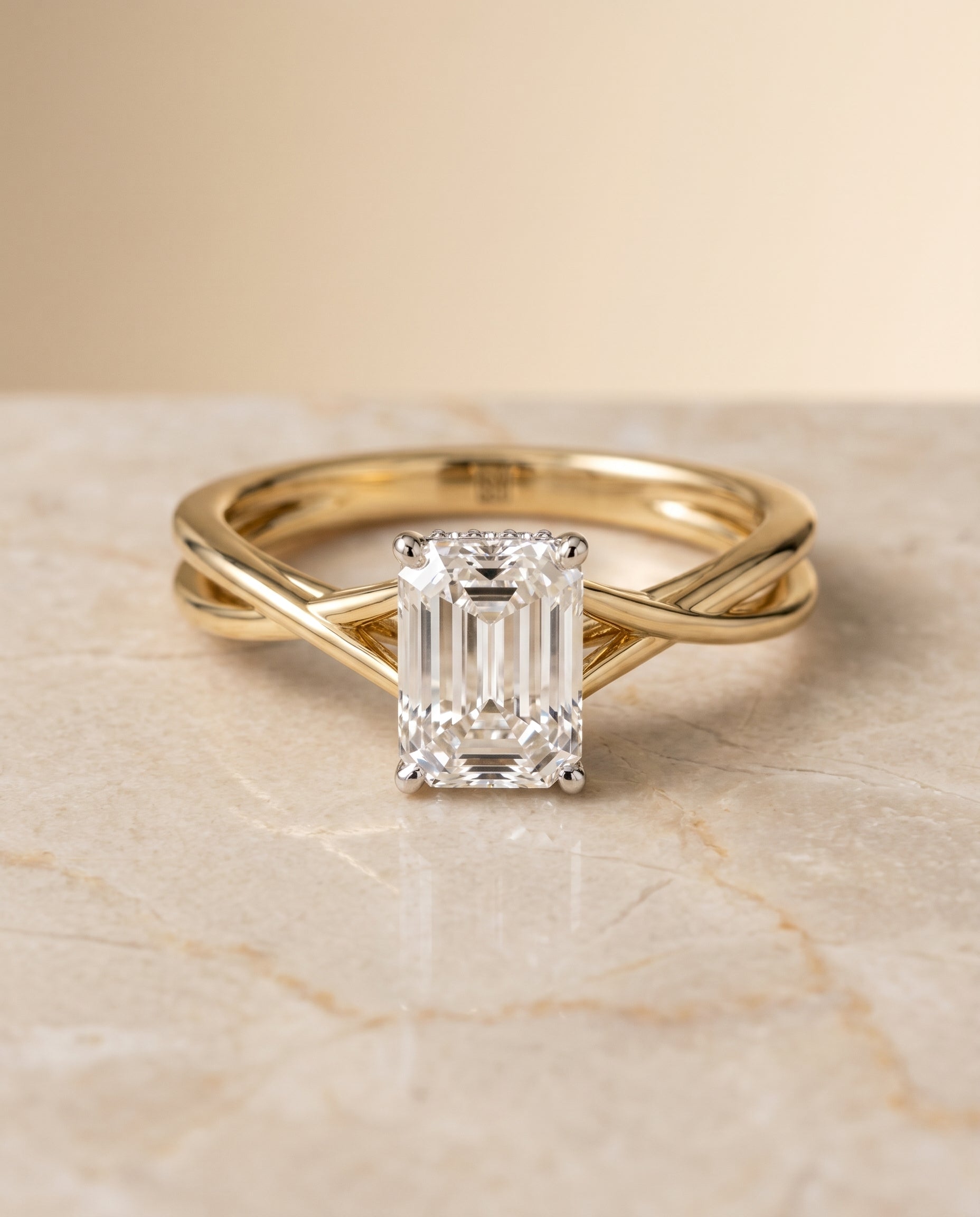The Blondie Twisted Hidden Halo Solitaire Engagement Ring Setting for Emerald Cut Diamonds in 18K Yellow Gold | RockHer