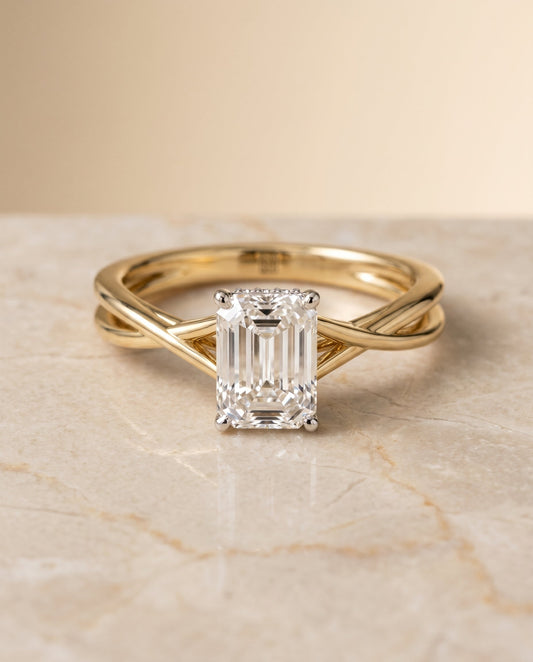 The Blondie Twisted Hidden Halo Solitaire Engagement Ring Setting for Emerald Cut Diamonds in 18K Yellow Gold | RockHer