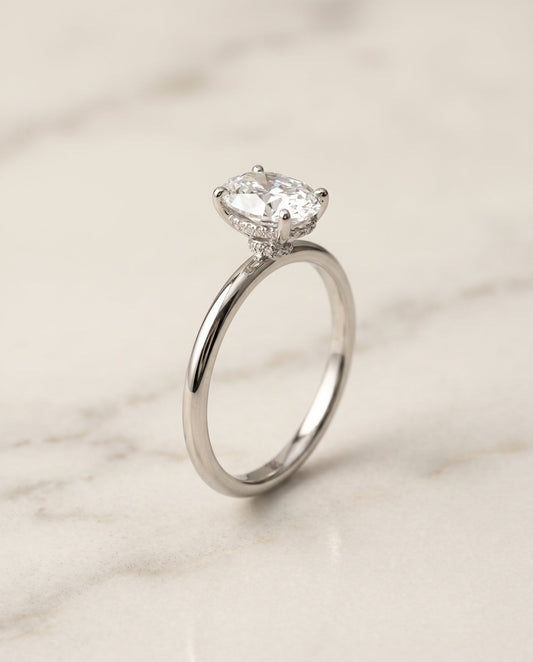 The Dolly Hidden Halo Solitaire Engagement Ring Setting for Oval Diamonds in 18K White Gold | RockHer