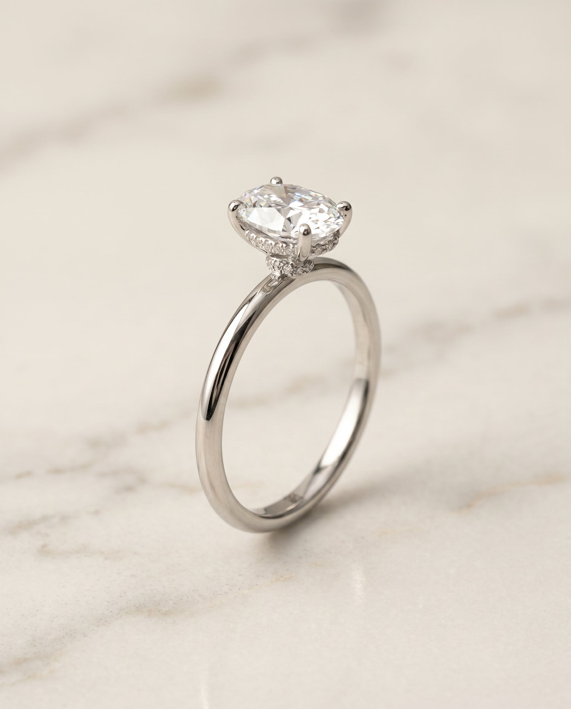 The Dolly Hidden Halo Solitaire Engagement Ring Setting for Oval Diamonds in 18K White Gold | RockHer