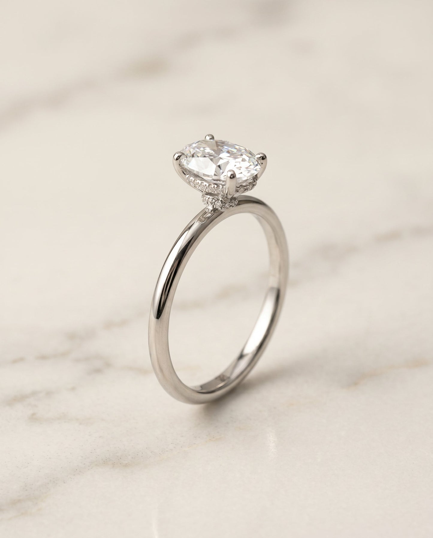 The Dolly Hidden Halo Solitaire Engagement Ring Setting for Oval Diamonds in 18K White Gold | RockHer
