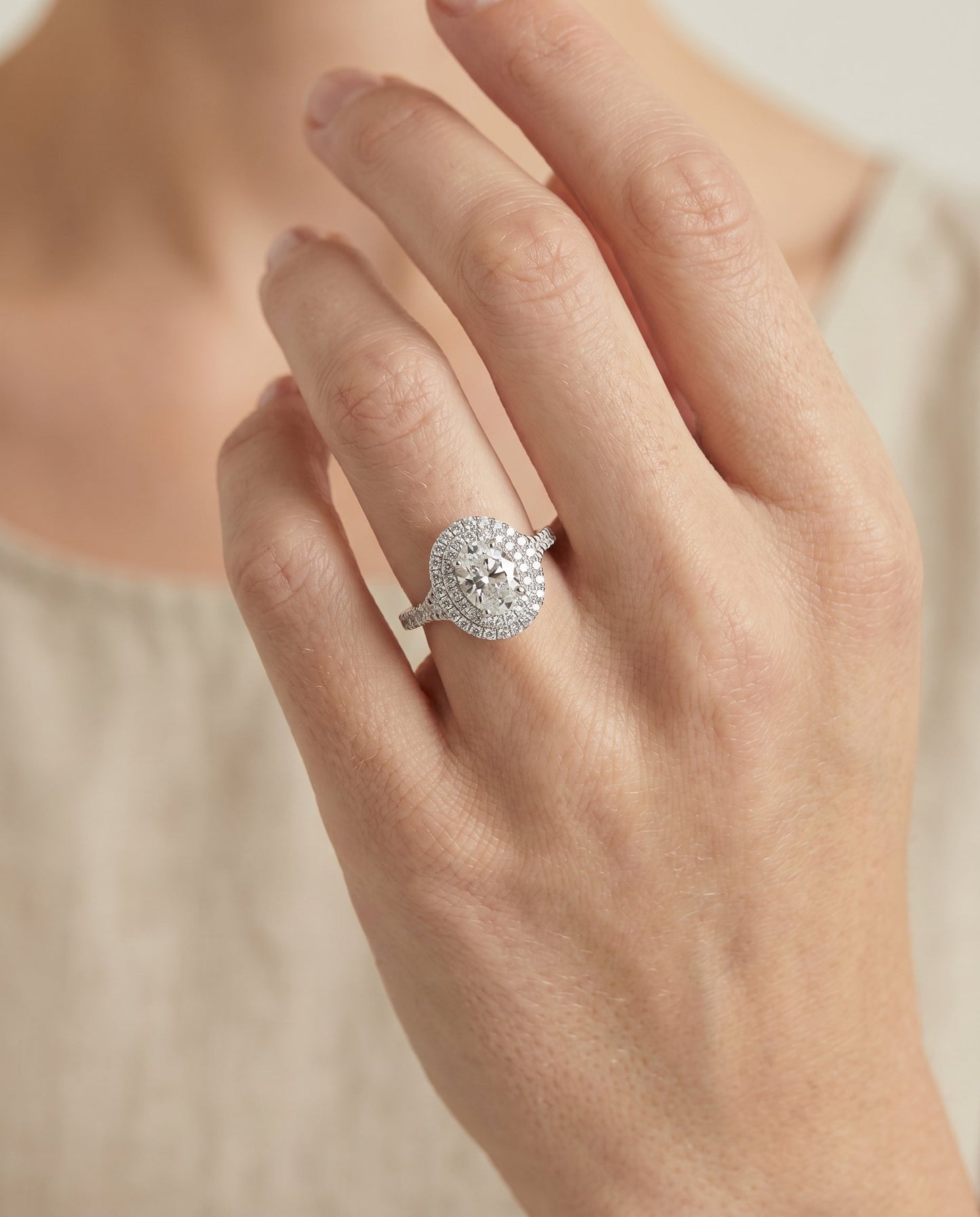 Double Scalloped Pavé Halo Oval, in Platinum, pave setting – lifestyle shot | RockHer