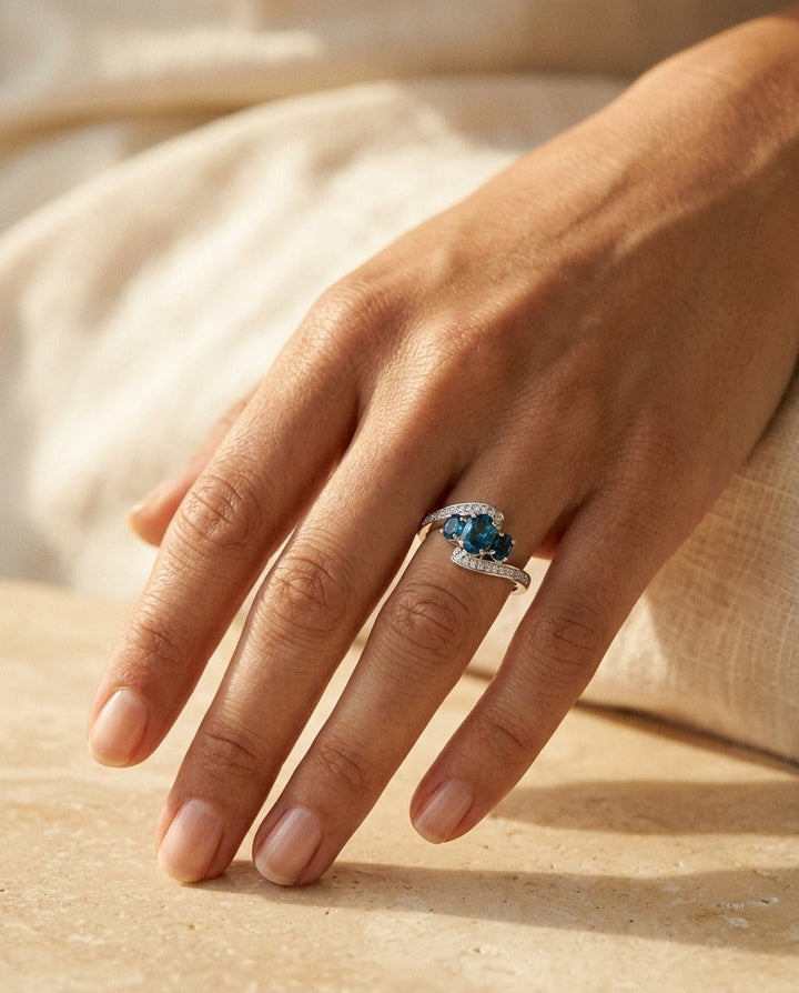 London Blue Topaz Three Stone Swirl Ring, in 14K White Gold – top view | RockHer