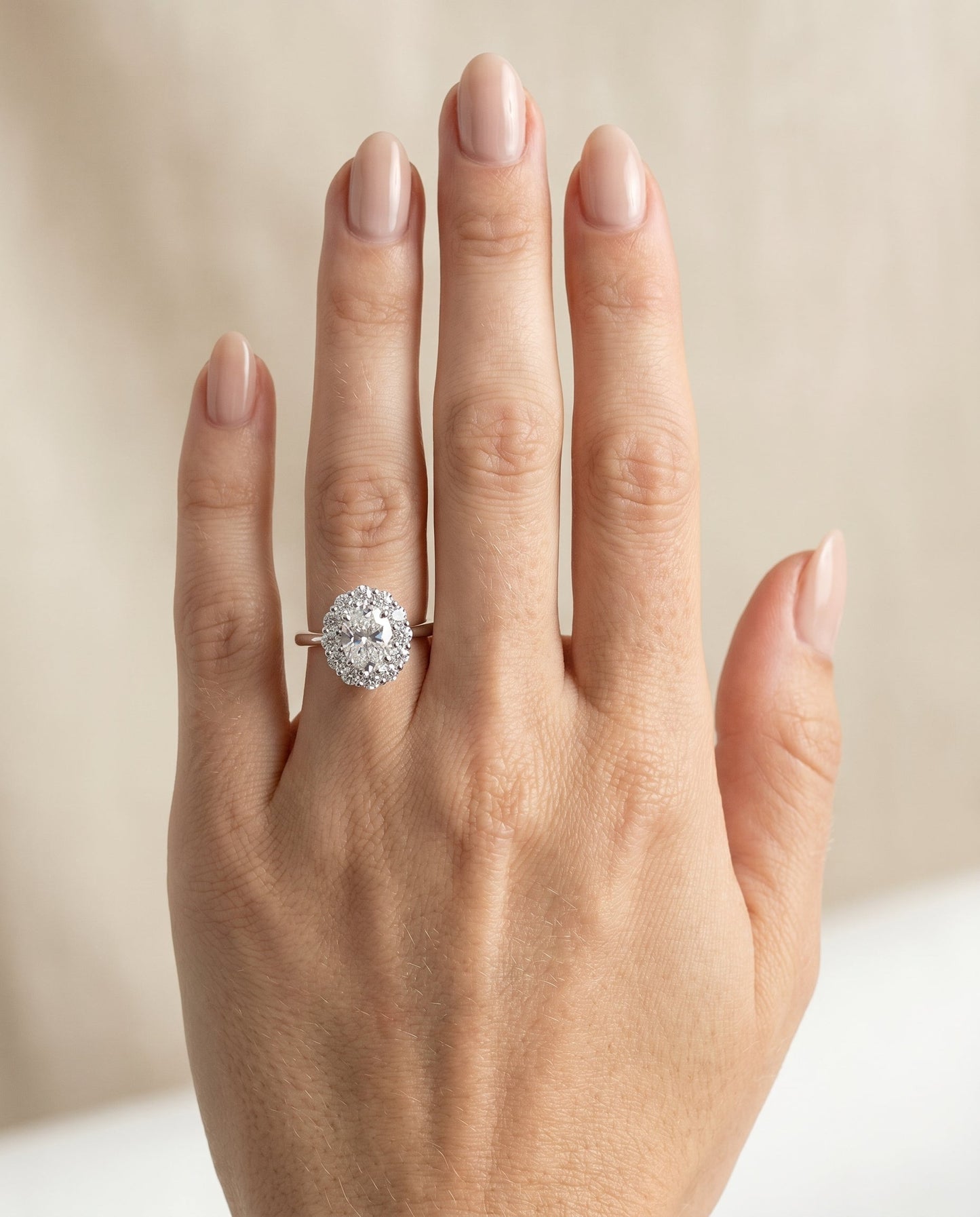 Faith floral prong halo engagement ring in platinum with oval lab diamond — RockHer