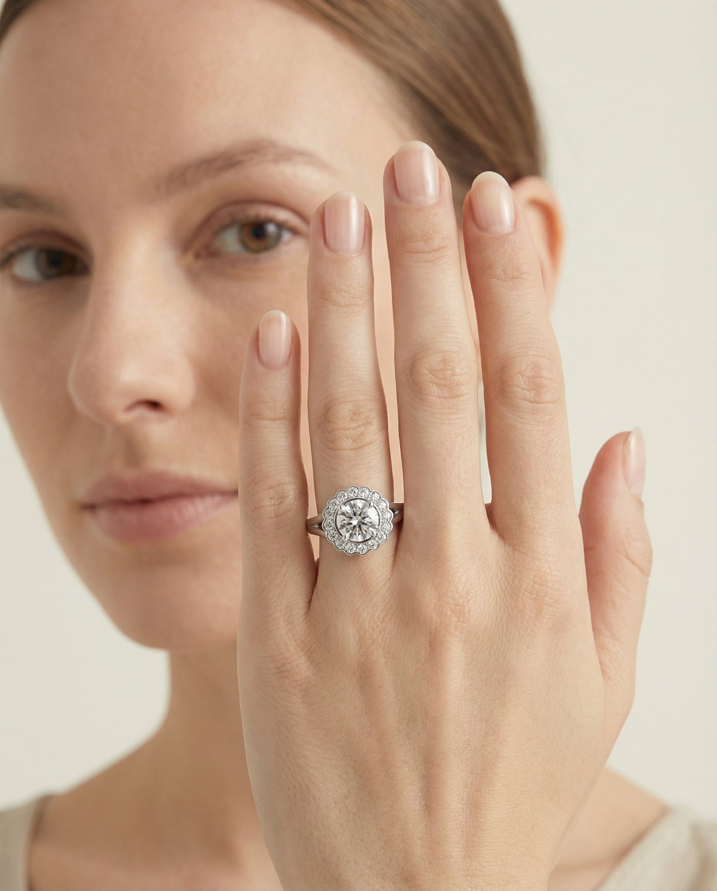 Round Brilliant, Floral Split Shank Halo, in 18K White Gold, prong setting – lifestyle shot | RockHer