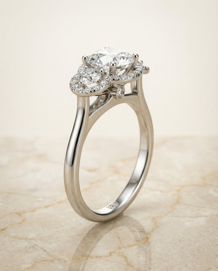Round Brilliant, French Pavé Three Stone, in Platinum, prong setting – front view | RockHer