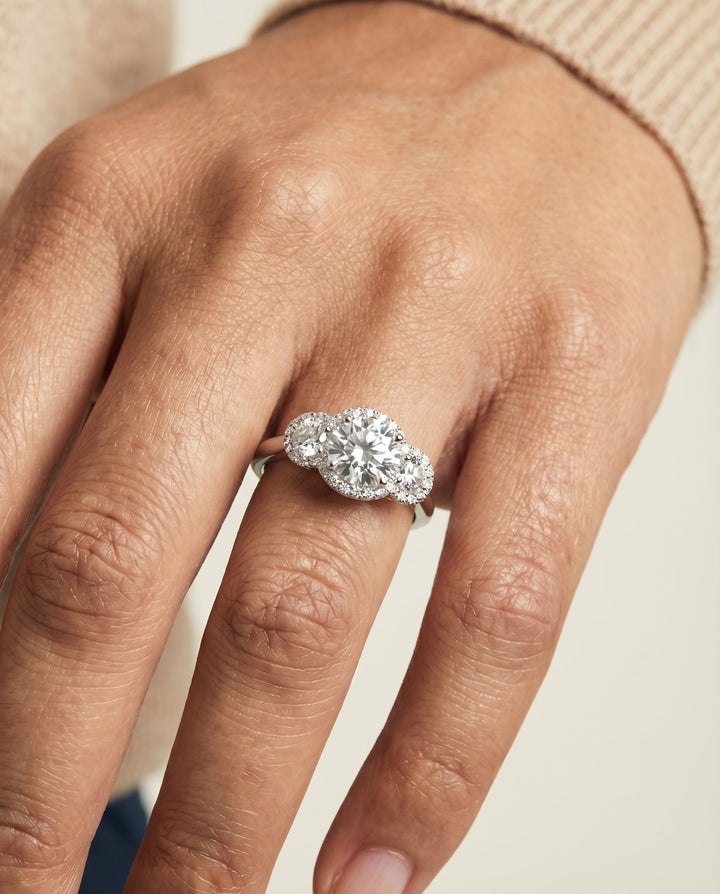 Round Brilliant, French Pavé Three Stone, in Platinum, prong setting – lifestyle shot | RockHer