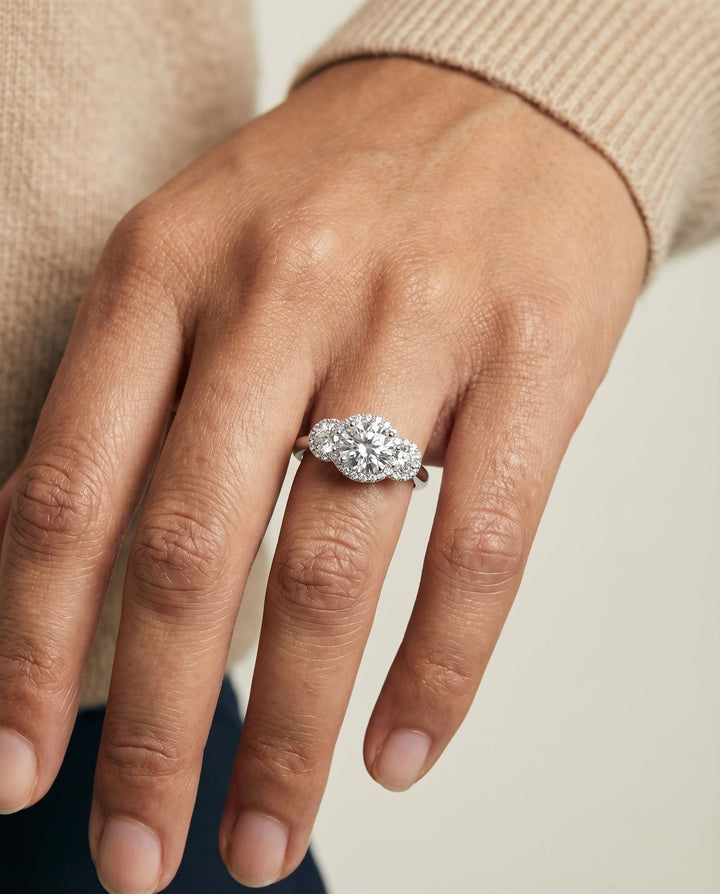 Round Brilliant, French Pavé Three Stone, in Platinum, prong setting – lifestyle shot | RockHer