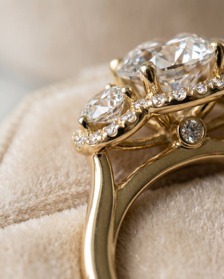 Round Brilliant, French Pavé Three Stone, in 18K Yellow Gold, prong setting – detail view | RockHer