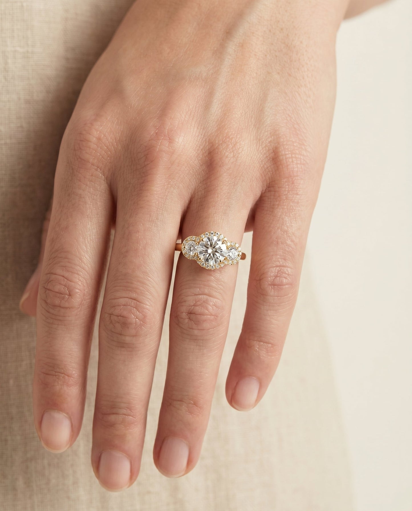 Round Brilliant, French Pavé Three Stone, in 18K Yellow Gold, prong setting – lifestyle shot | RockHer