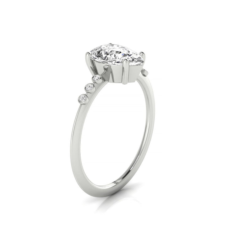 14kw Pear Engagement Ring With 6 Bezel Set Round Diamonds On Shank