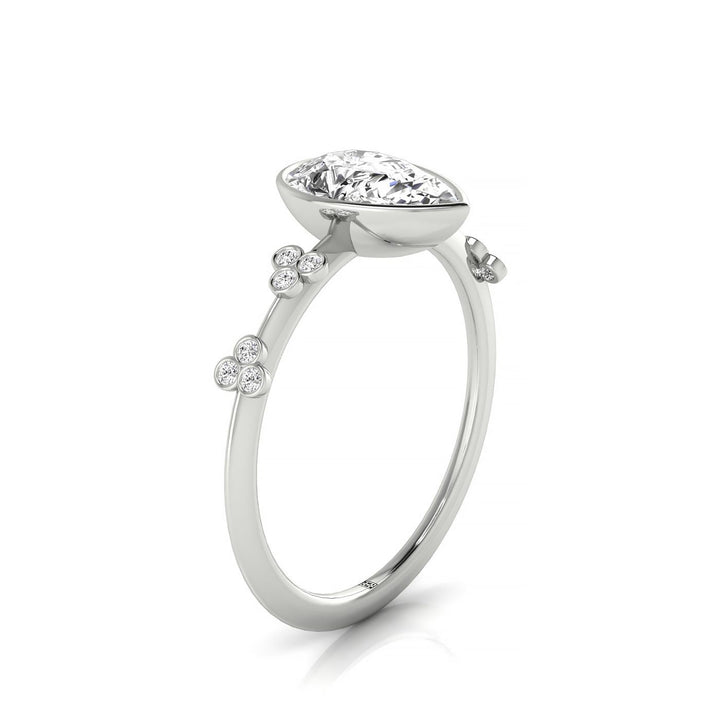 18kw Bezel Set Pear Engagement Ring With 12 Clover Bezel Set Round Diamonds On Shank