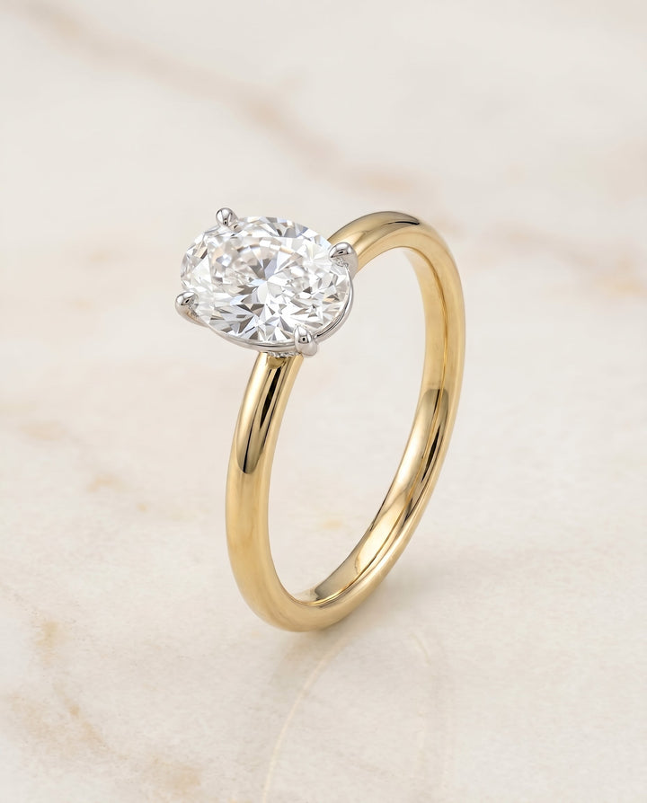 The Joni Hidden Halo Solitaire Engagement Ring Setting for Oval Diamonds in 18K Yellow Gold