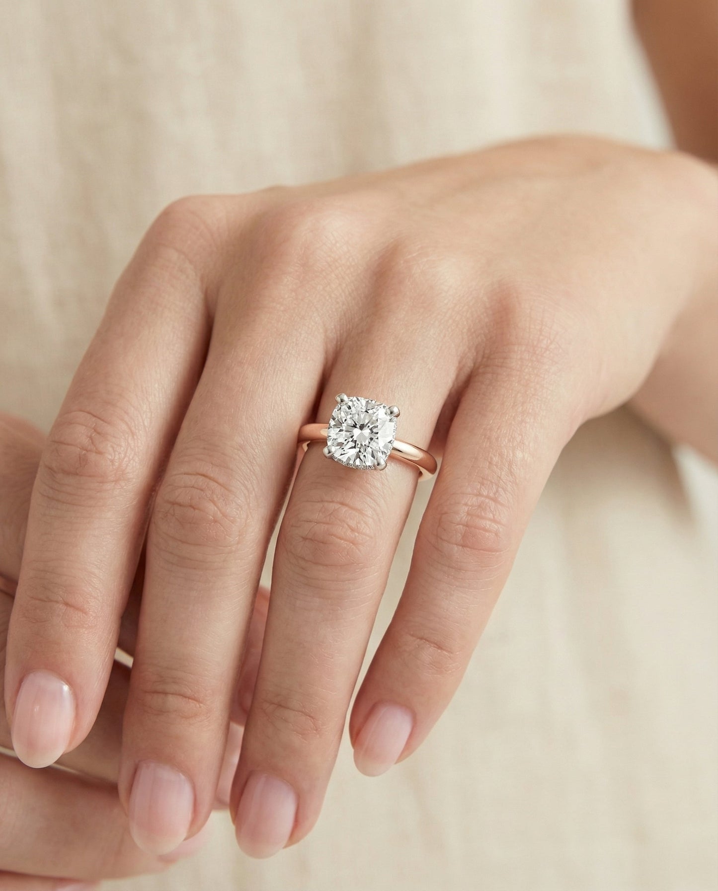 Hidden Pavé Basket Crown Solitaire Cushion, in 14K Rose Gold, prong setting – lifestyle shot | RockHer