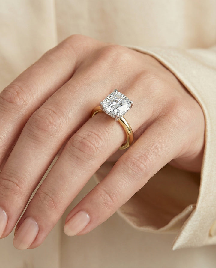 Hidden Pavé Basket Crown Solitaire Cushion, in 18K Yellow Gold – lifestyle shot | RockHer