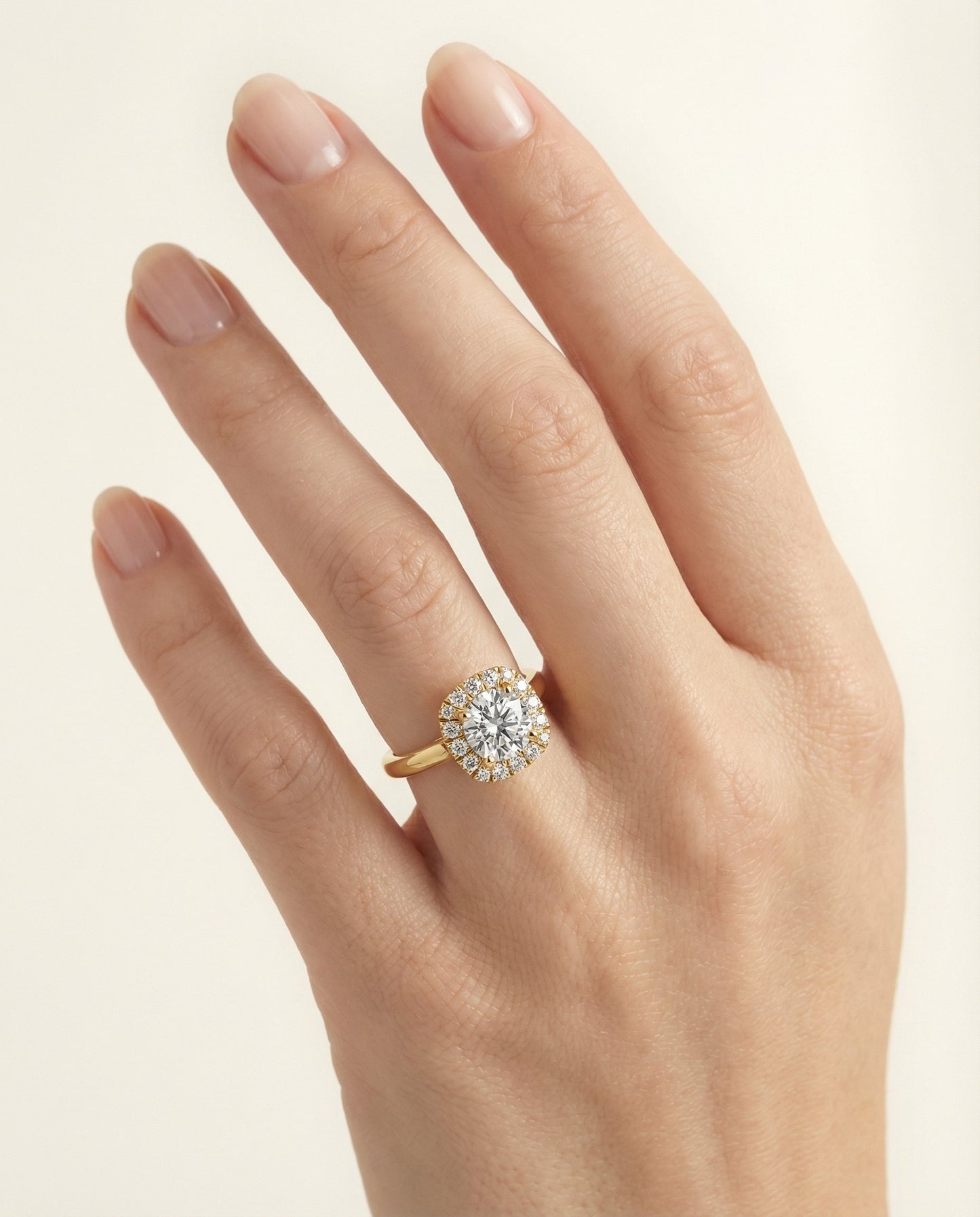 High Polish Simple Halo Cushion, in 18K Yellow Gold, prong setting – lifestyle shot | RockHer