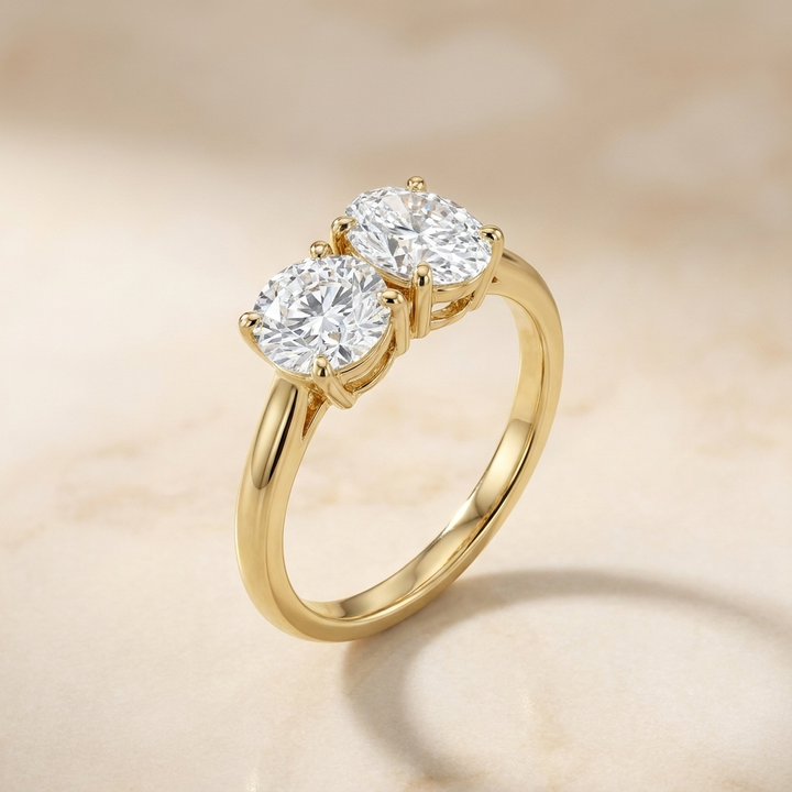 18K Yellow Gold Jackie Select Toi et Moi Round & Oval Knife Edge Band Lab Diamond Engagement Ring - Alt angle on warm marble