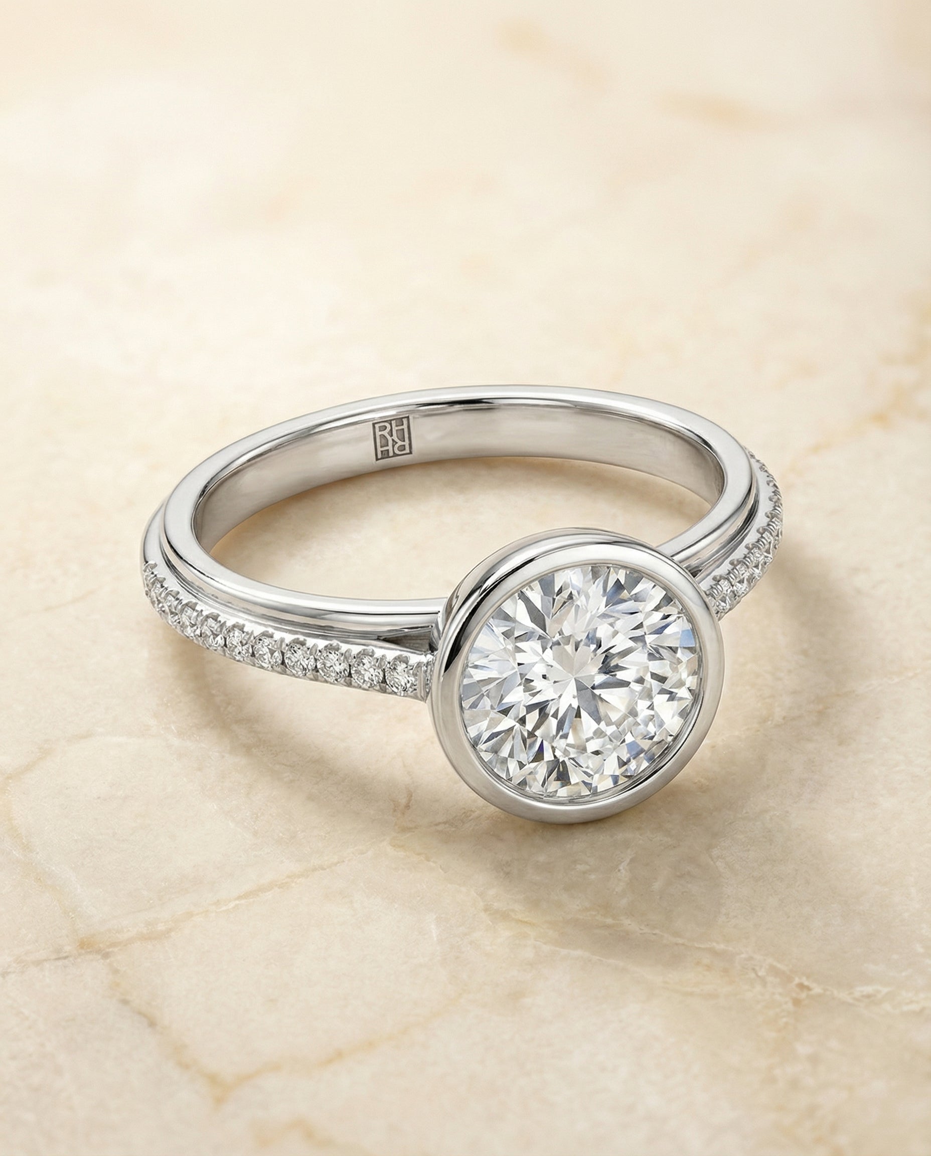 Round Brilliant, Linear Bezel Pavé, in Platinum – angled view | RockHer