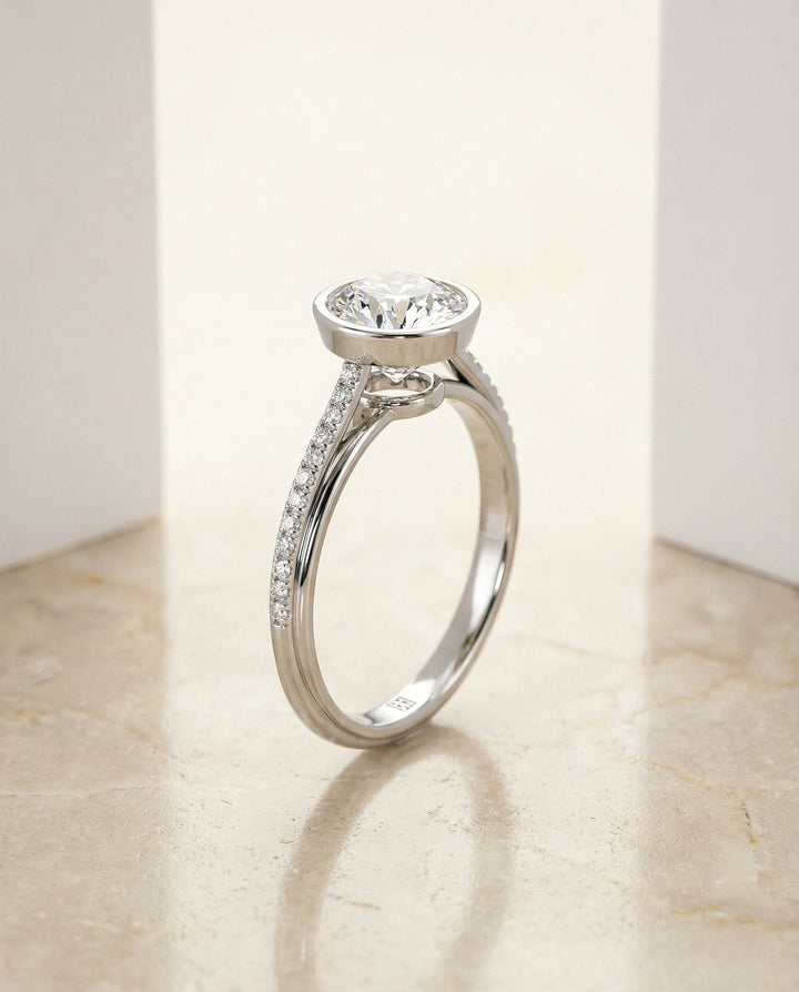 Round Brilliant, Linear Bezel Pavé, in Platinum – front view | RockHer