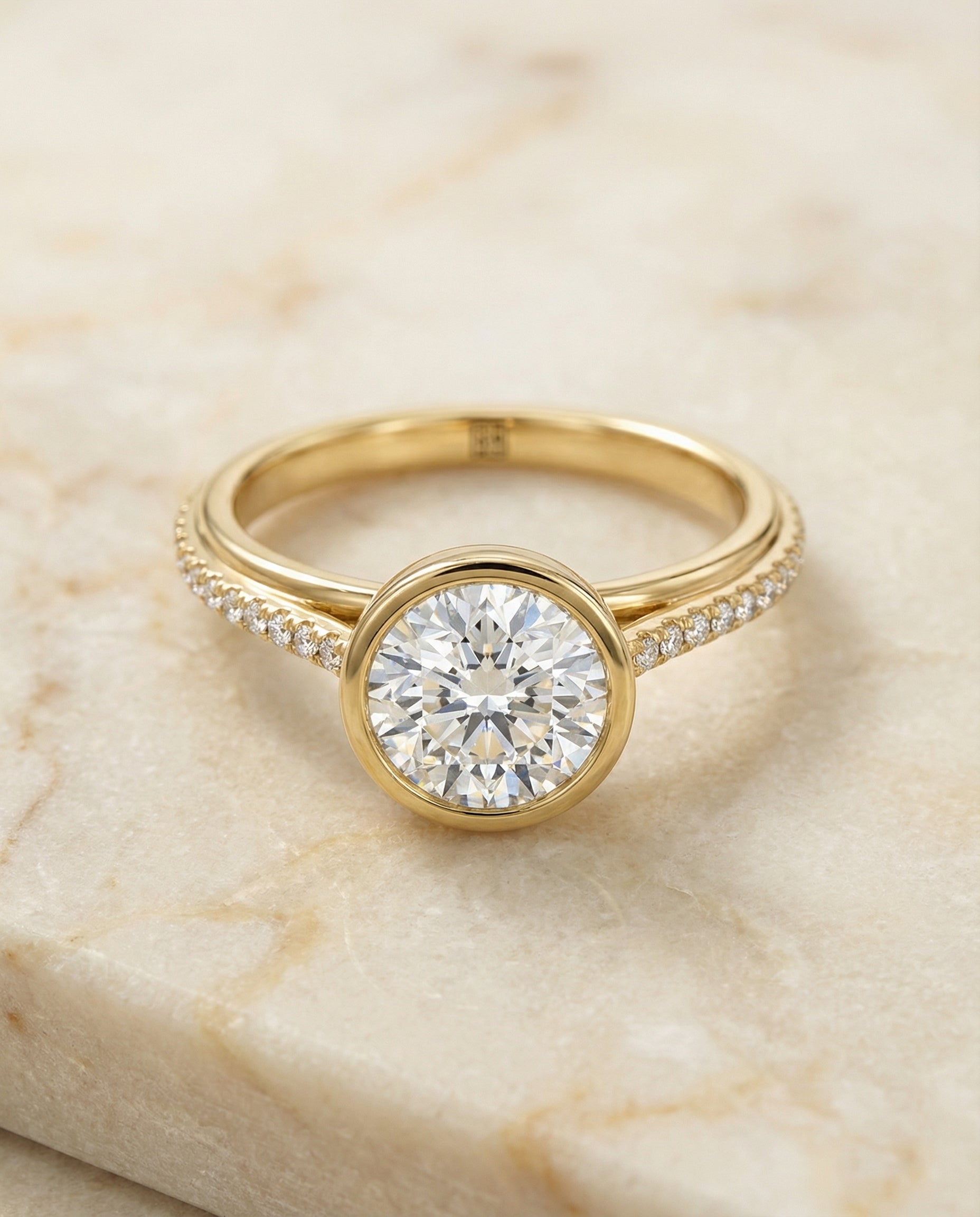 Round Brilliant, Linear Bezel Pavé, in 18K Yellow Gold – angled view | RockHer