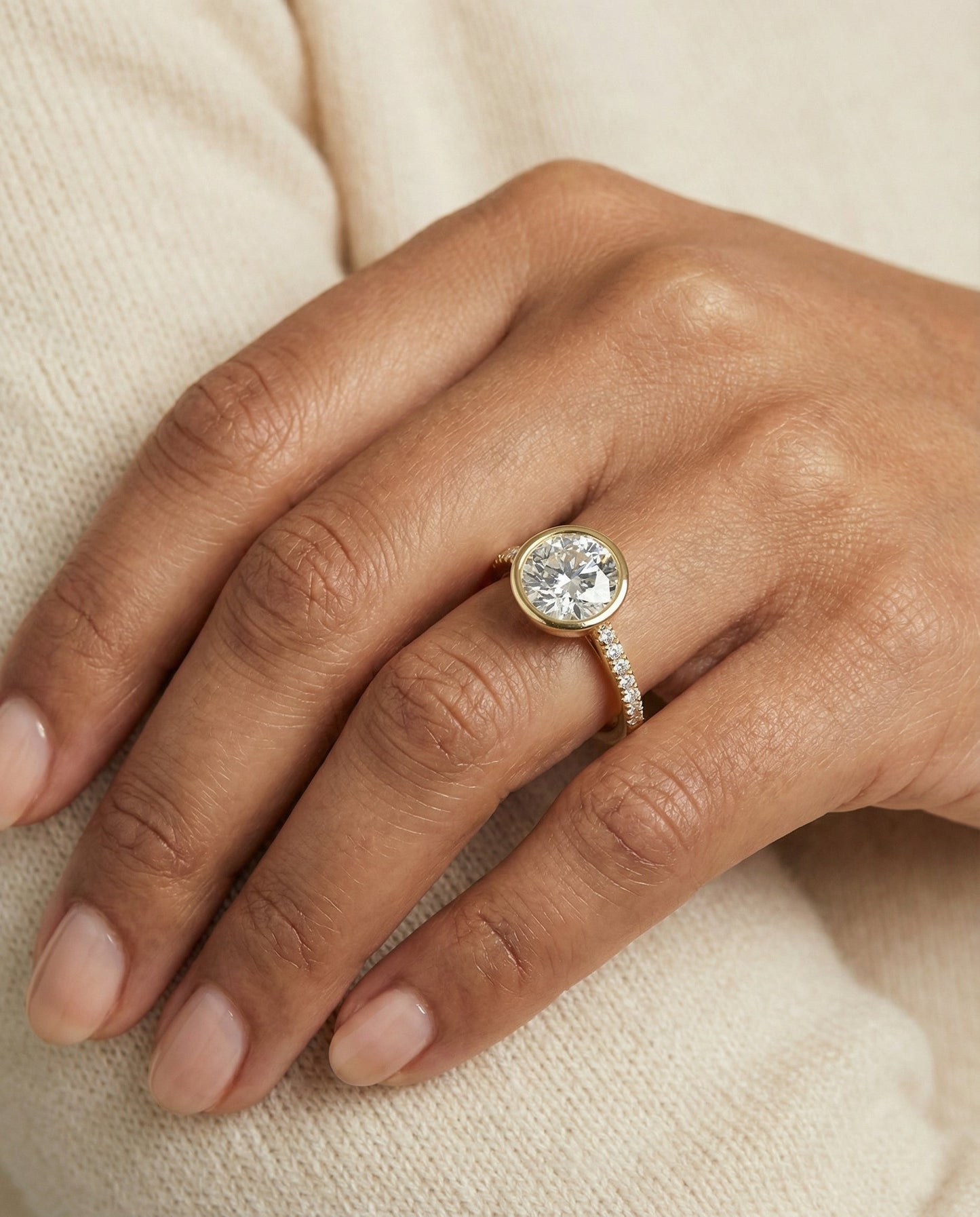 Round Brilliant, Linear Bezel Pavé, in 18K Yellow Gold – lifestyle shot | RockHer