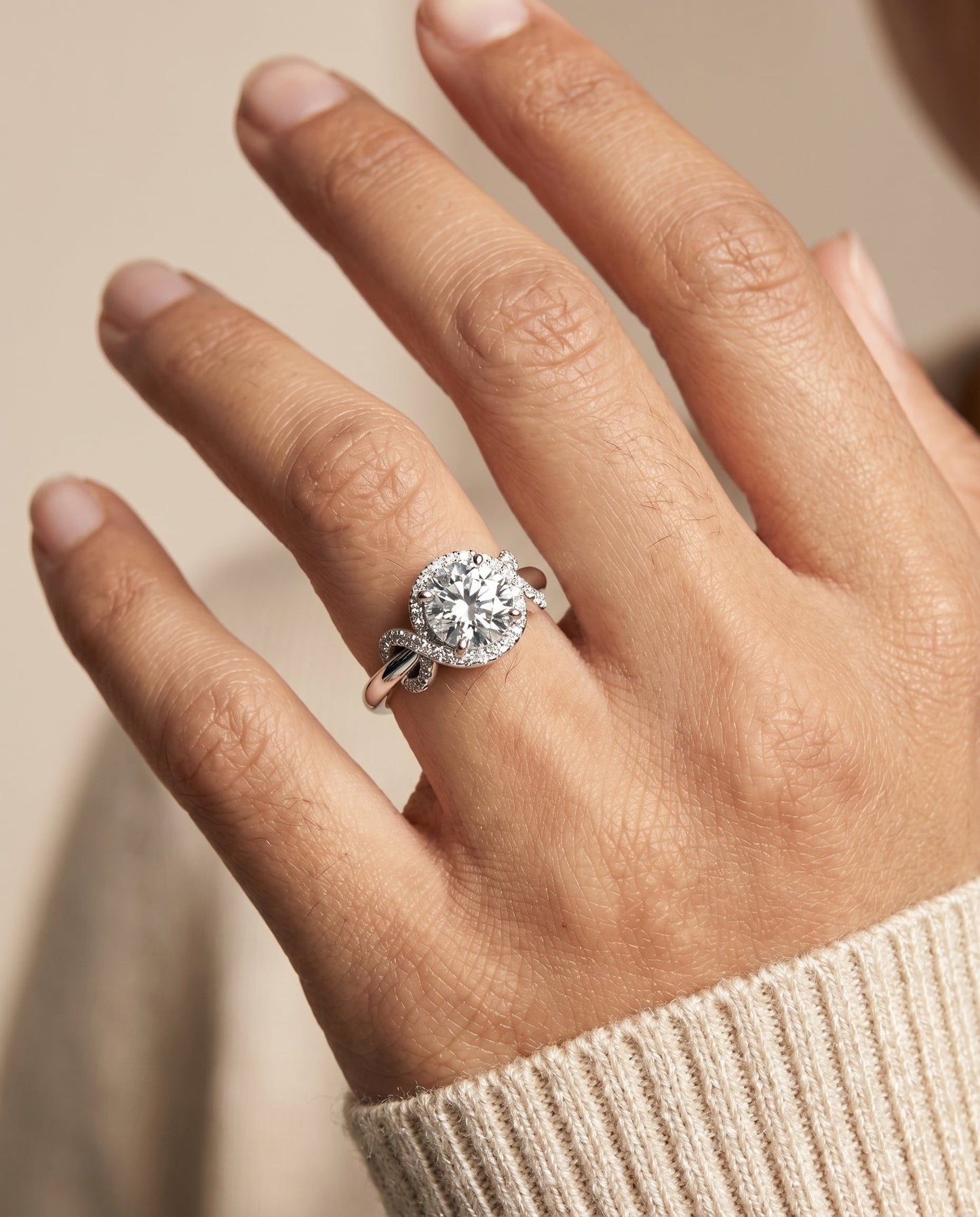 Round Brilliant, Love Knot Halo, in Platinum, pave setting – lifestyle shot | RockHer