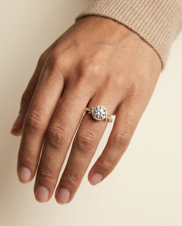 Round Brilliant, Love Knot Pavé Halo, in 18K Yellow Gold, pave setting – lifestyle shot | RockHer