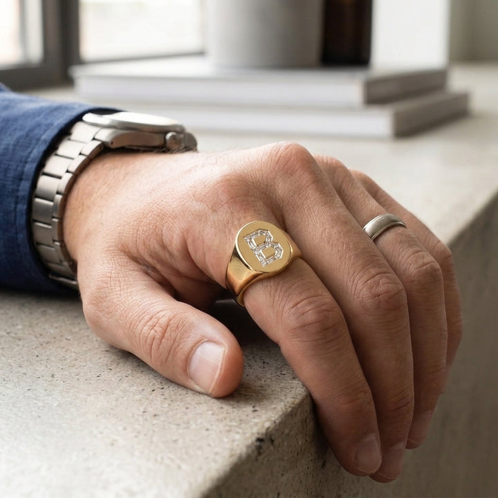 Men's Oval lab-grown diamond letter signet ring in 14K Yellow Gold, worn on hand