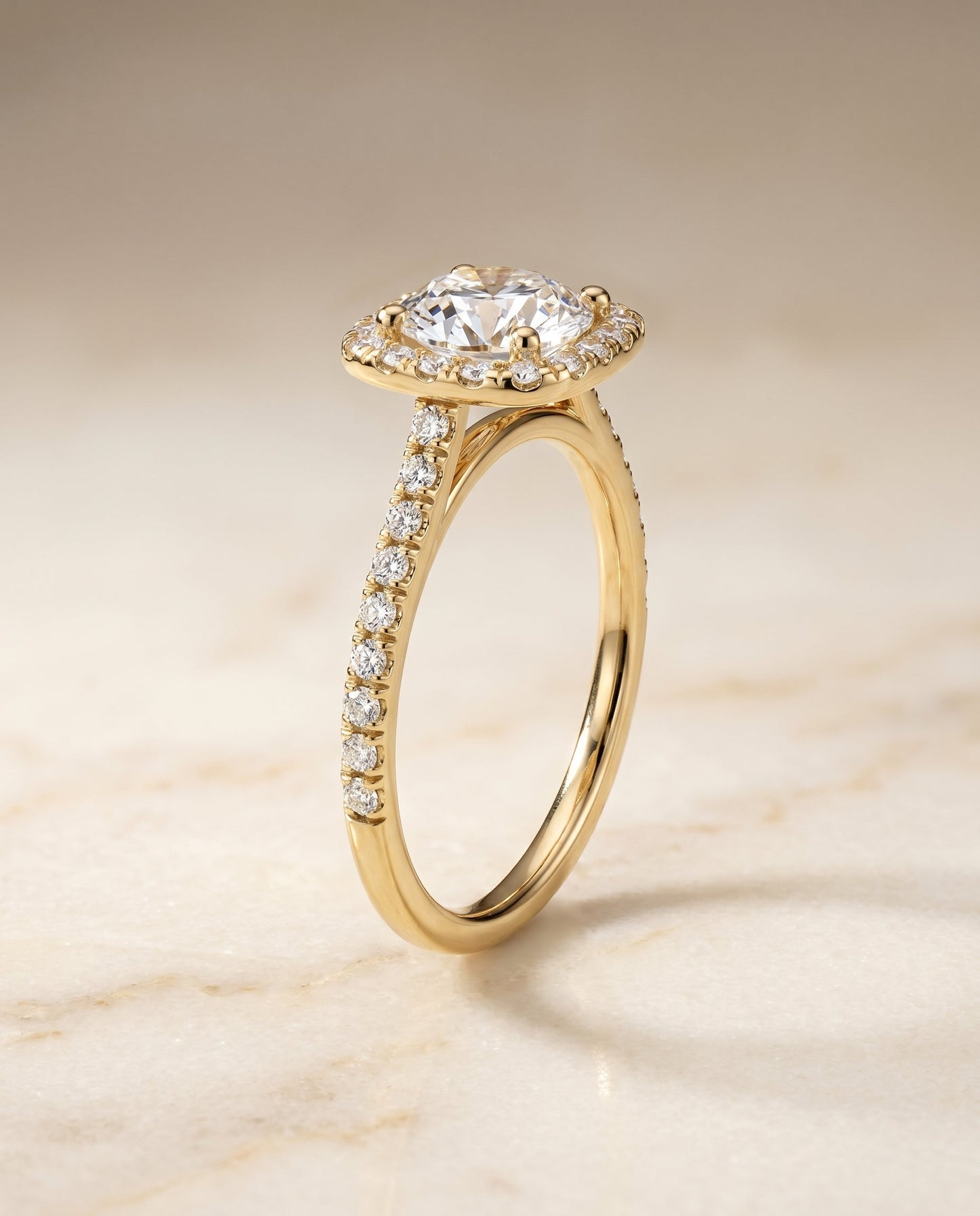 Round Brilliant, Pavé Halo, in 18K Yellow Gold, pave setting – angled view | RockHer