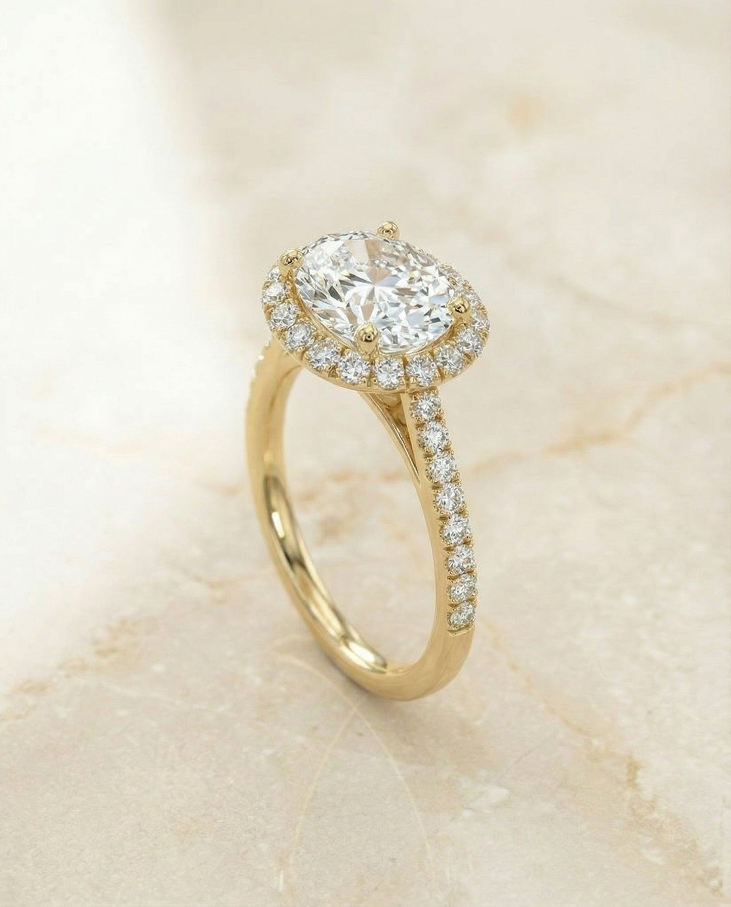 Dylan Select Petite French Pavé Halo Oval Engagement Ring, in 14K Yellow Gold, pave setting – angled view | RockHer